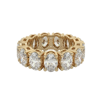 Gold ring with diamonds on a white background