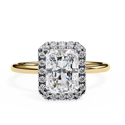 Gold ring with a large diamond and smaller diamonds on a white background