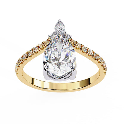 Gold ring with a large pear-shaped diamond and smaller diamonds on the band against a white background