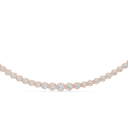 Rose gold necklace with clear gemstones on a white background