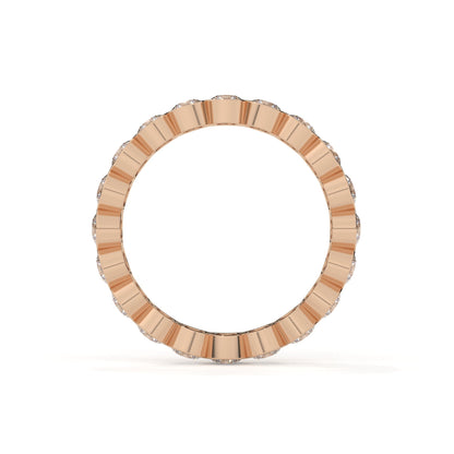 Gold ring with a textured band on a white background