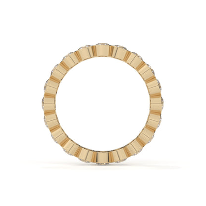 Gold ring with a textured band on a white background