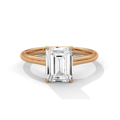Rose gold ring with a large diamond on a white background