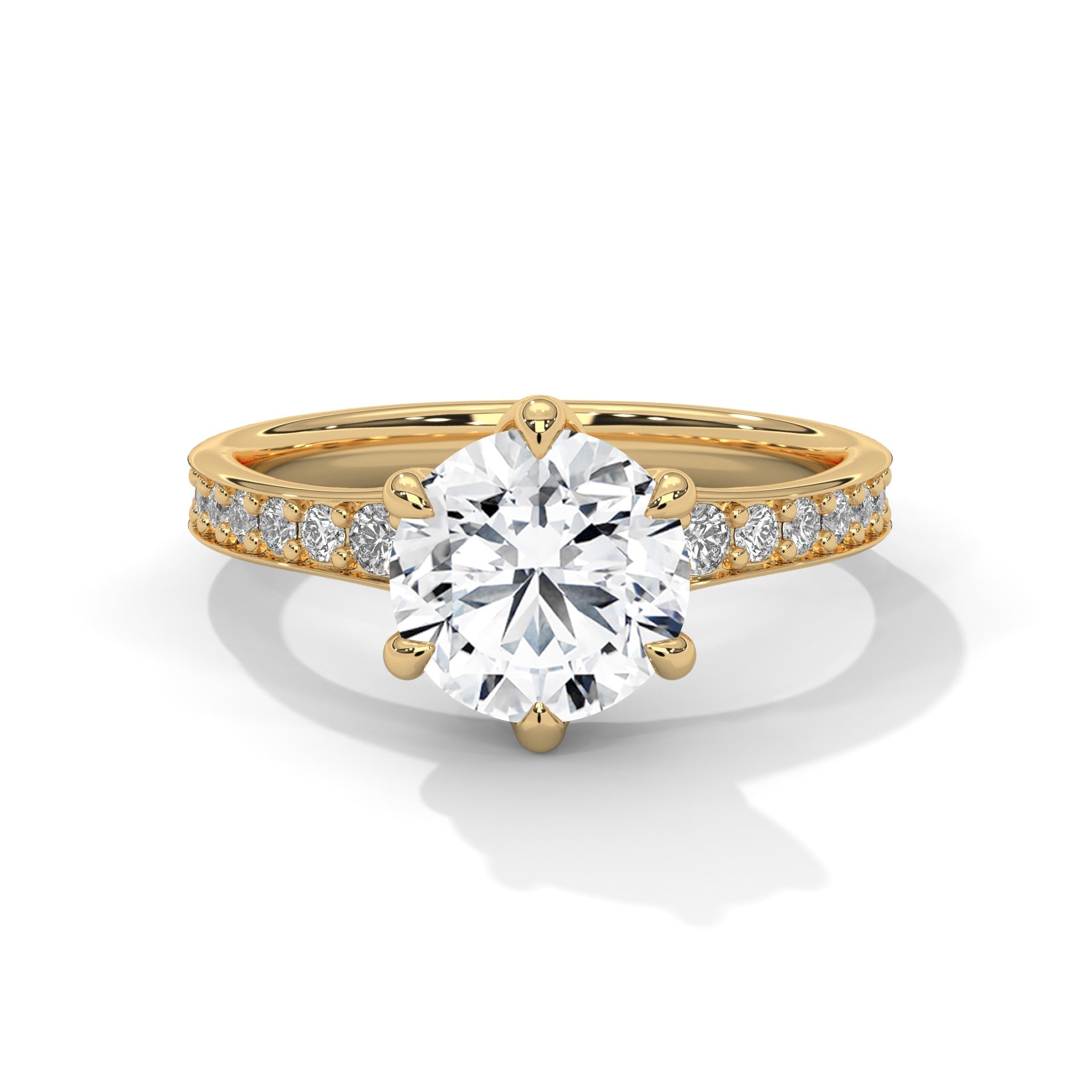 Gold ring with a large diamond and smaller diamonds on the band against a white background