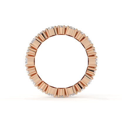 Rose gold ring with diamond accents on a white background