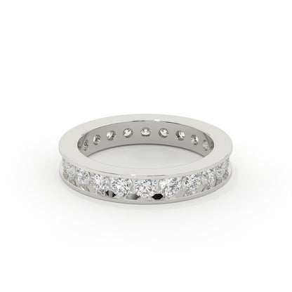 Silver ring with embedded diamonds on a white background