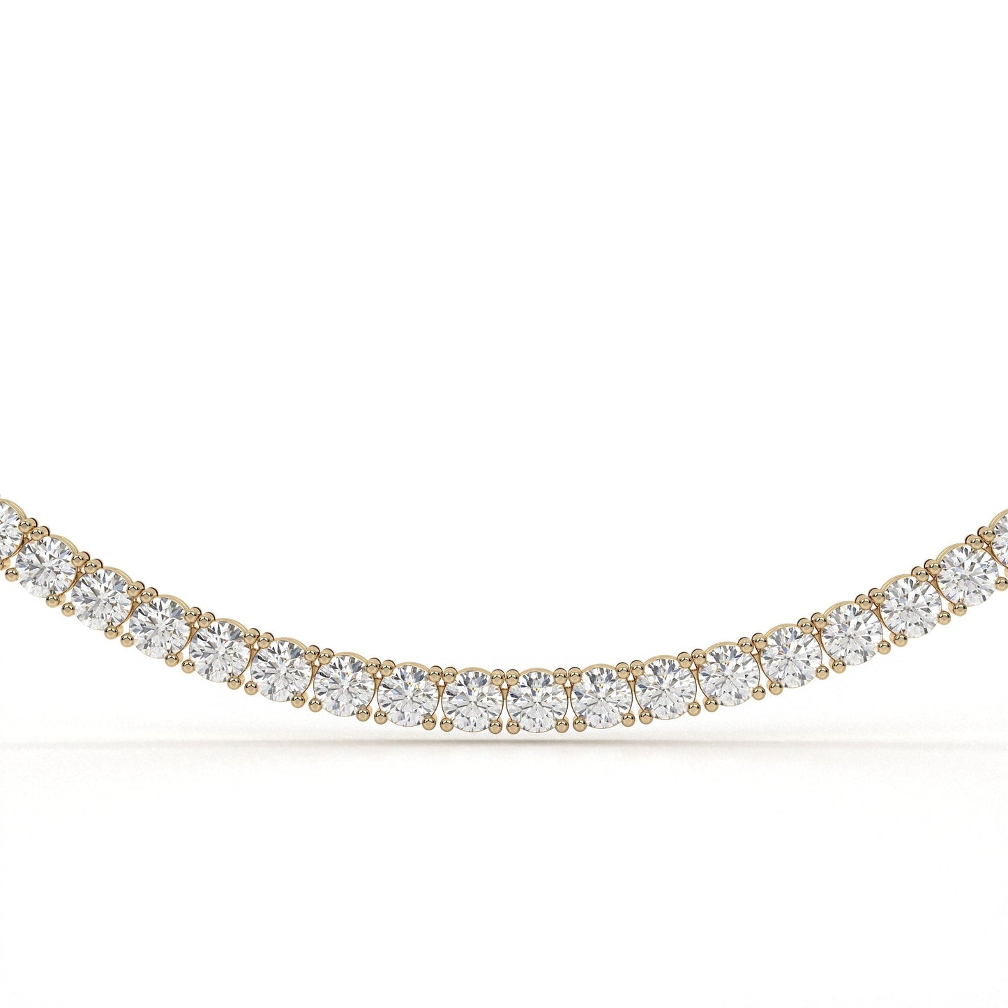 Gold and diamond necklace on a white background