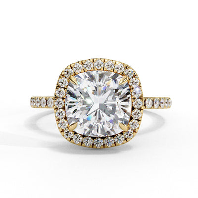 Gold ring with a large diamond and smaller diamonds around on a white background