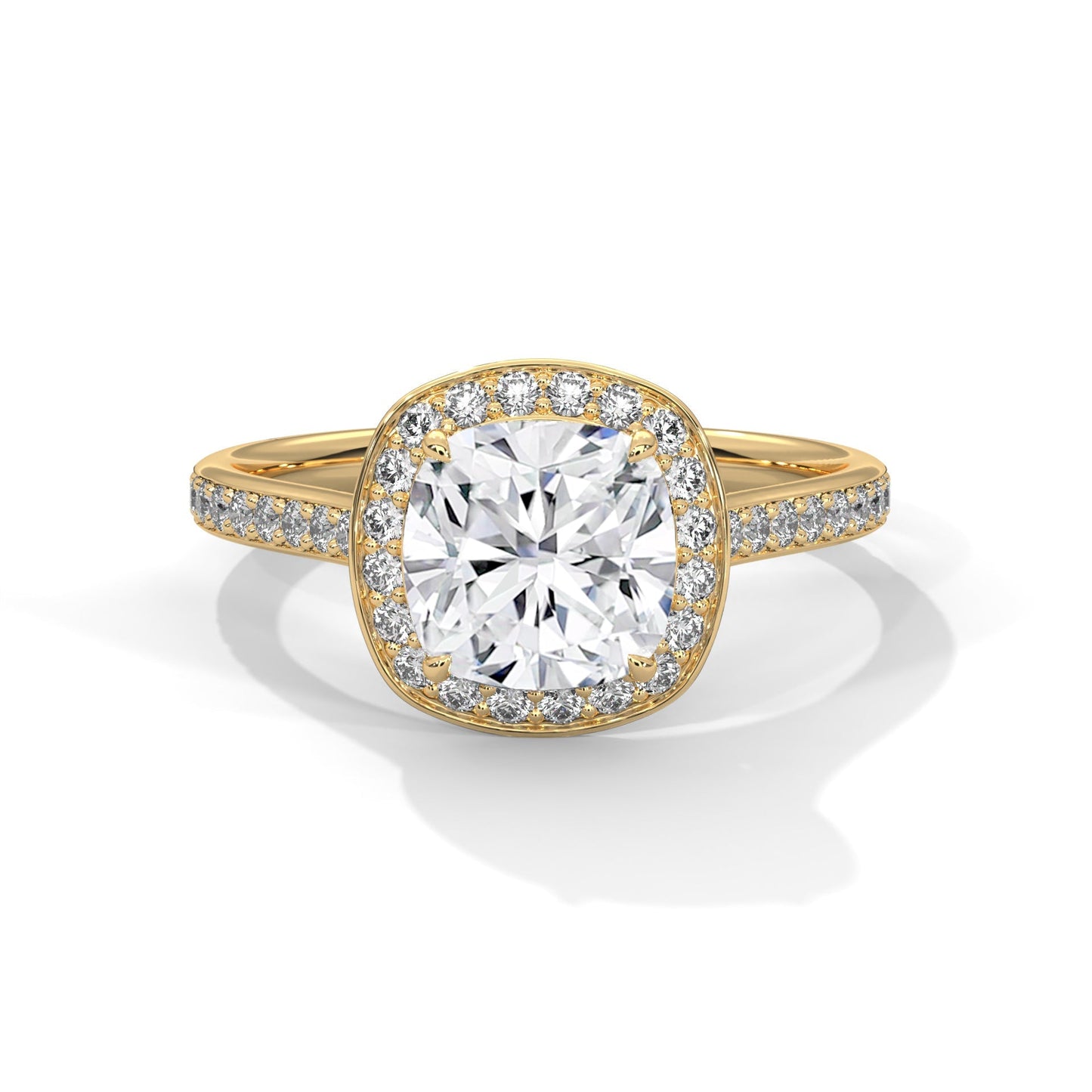 Gold ring with a large diamond and smaller diamonds on the band against a white background