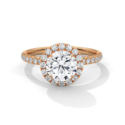 Rose gold diamond ring on a white background