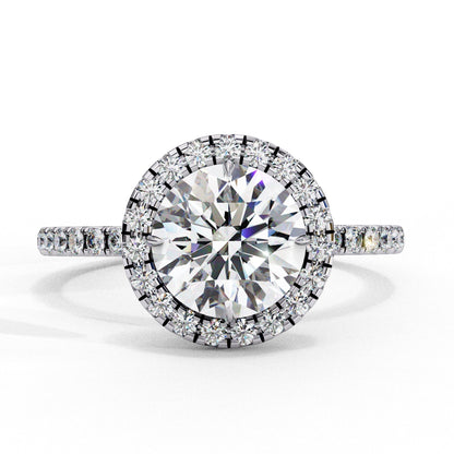 Diamond ring with a large central gemstone and smaller stones on a white background