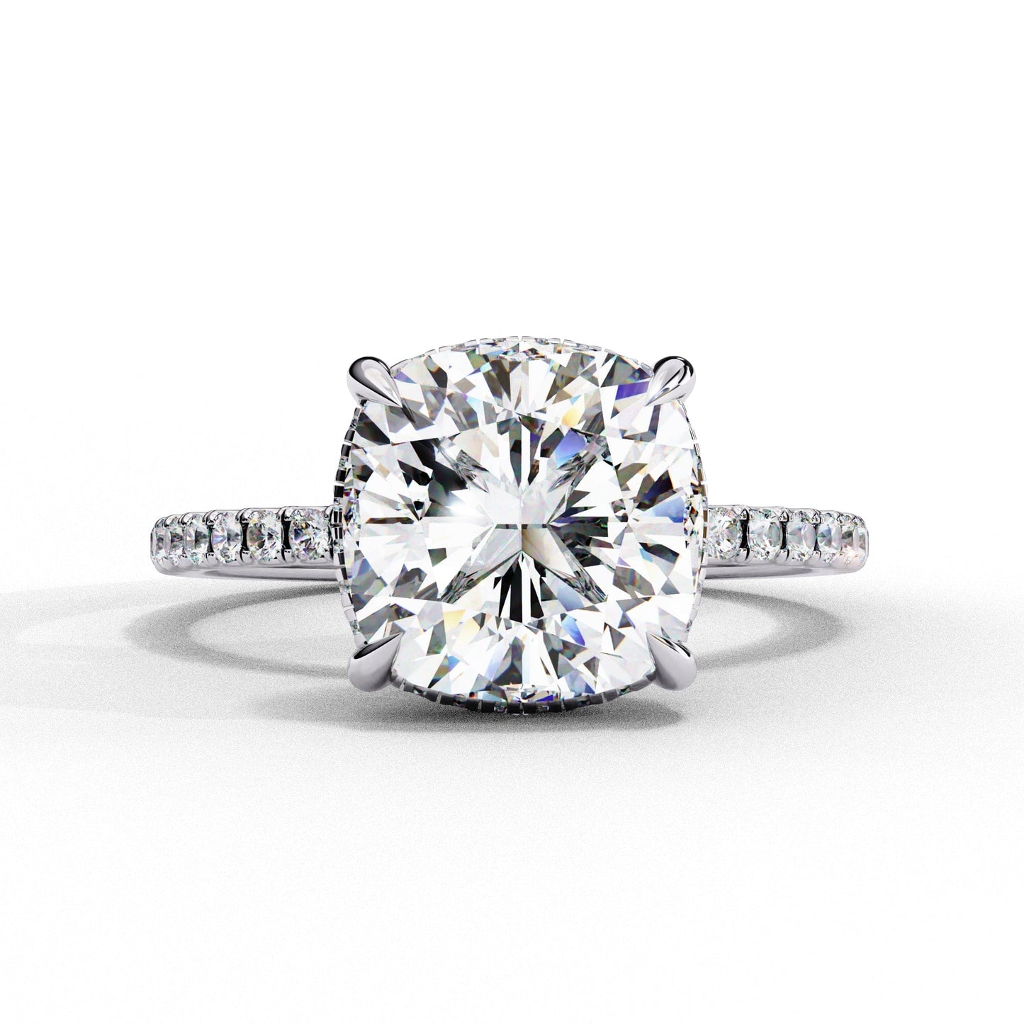Diamond ring with a large central gemstone and smaller stones on a white background