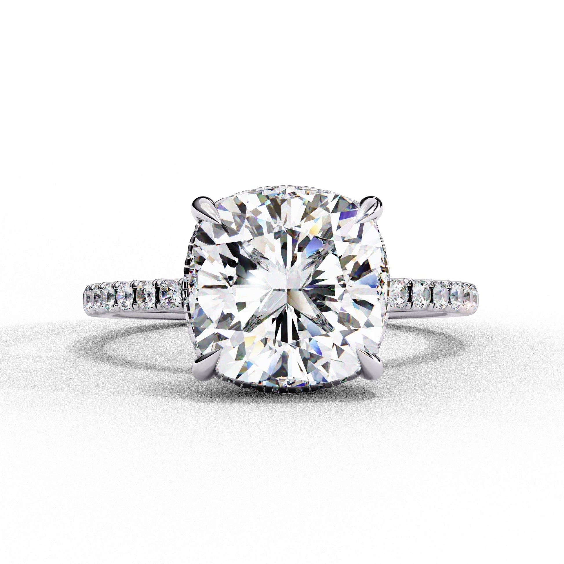 Diamond ring with a large central gemstone and smaller stones on a white background