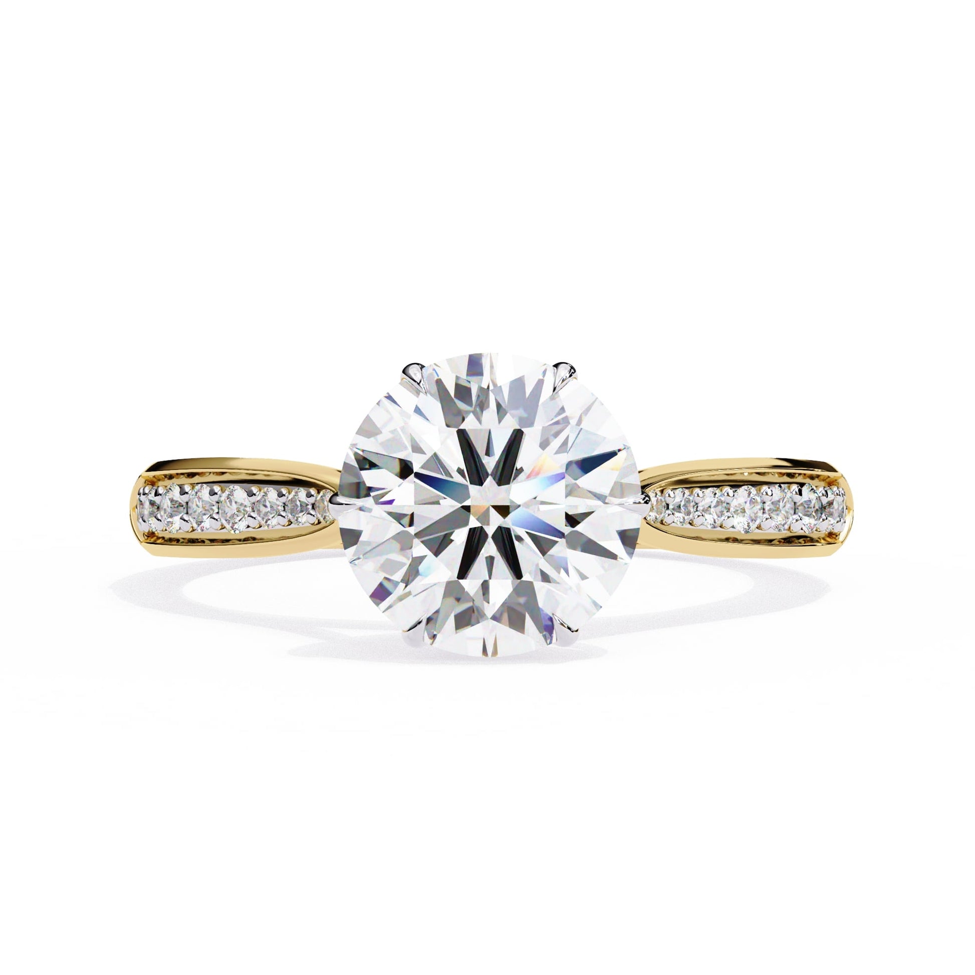 Gold ring with a large diamond and smaller diamonds on the band against a white background