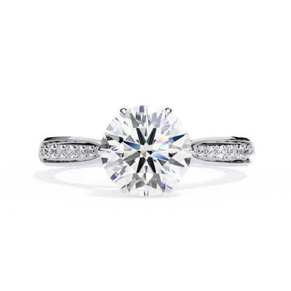 Diamond ring with a large central gemstone on a white background