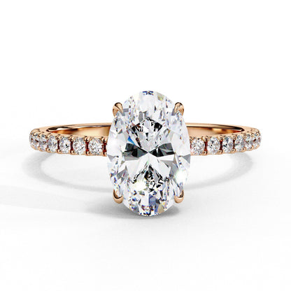 Rose gold ring with a large diamond and smaller diamonds on the band against a white background