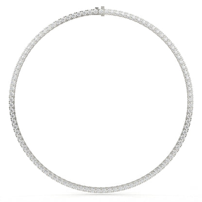 Silver necklace with small round stones on a white background