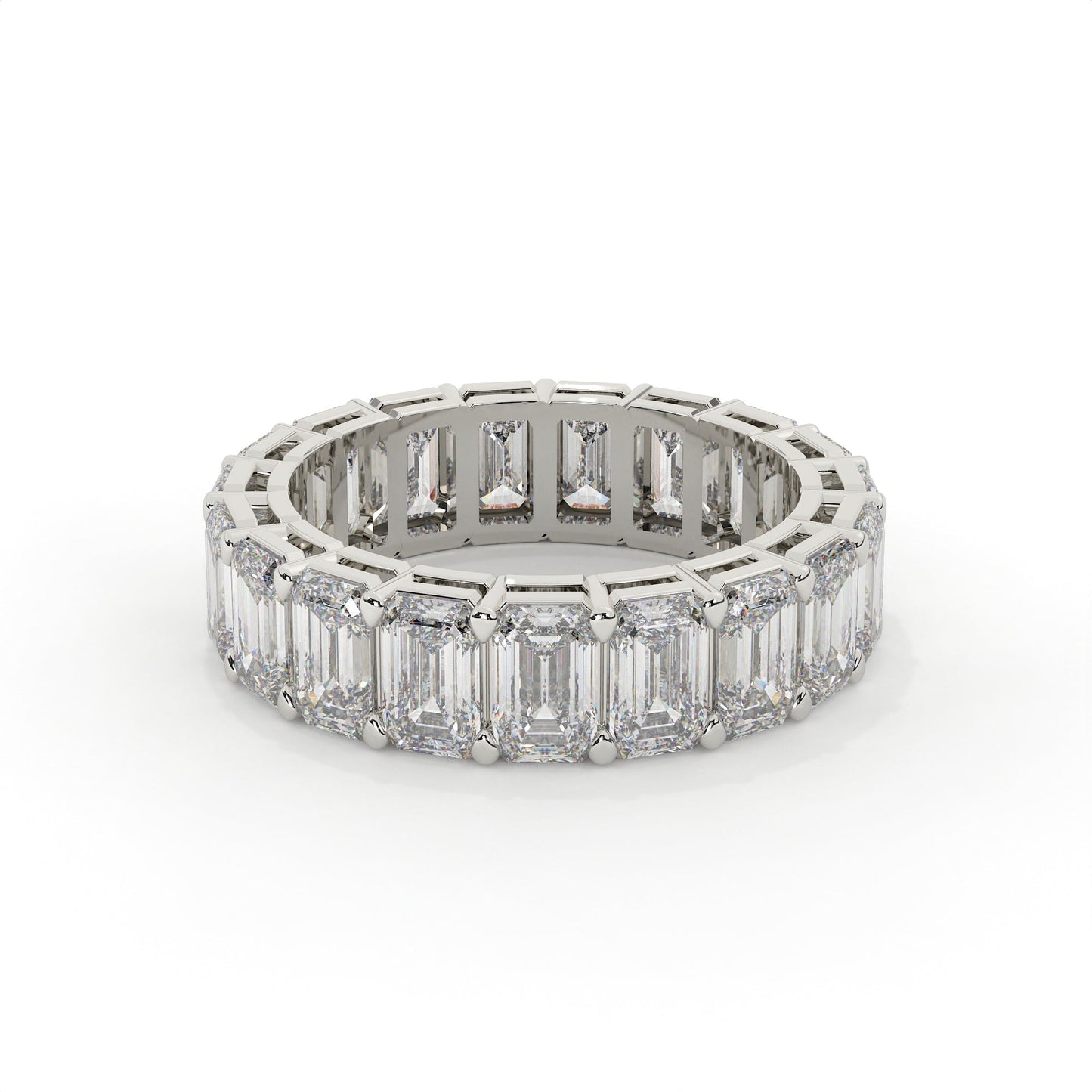 Diamond ring with emerald-cut stones on a white background