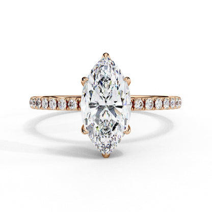 Diamond ring with a pear-shaped center stone on a white background