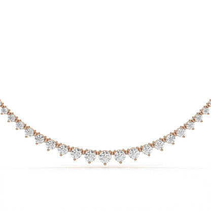 Rose gold necklace with heart-shaped diamonds on a white background