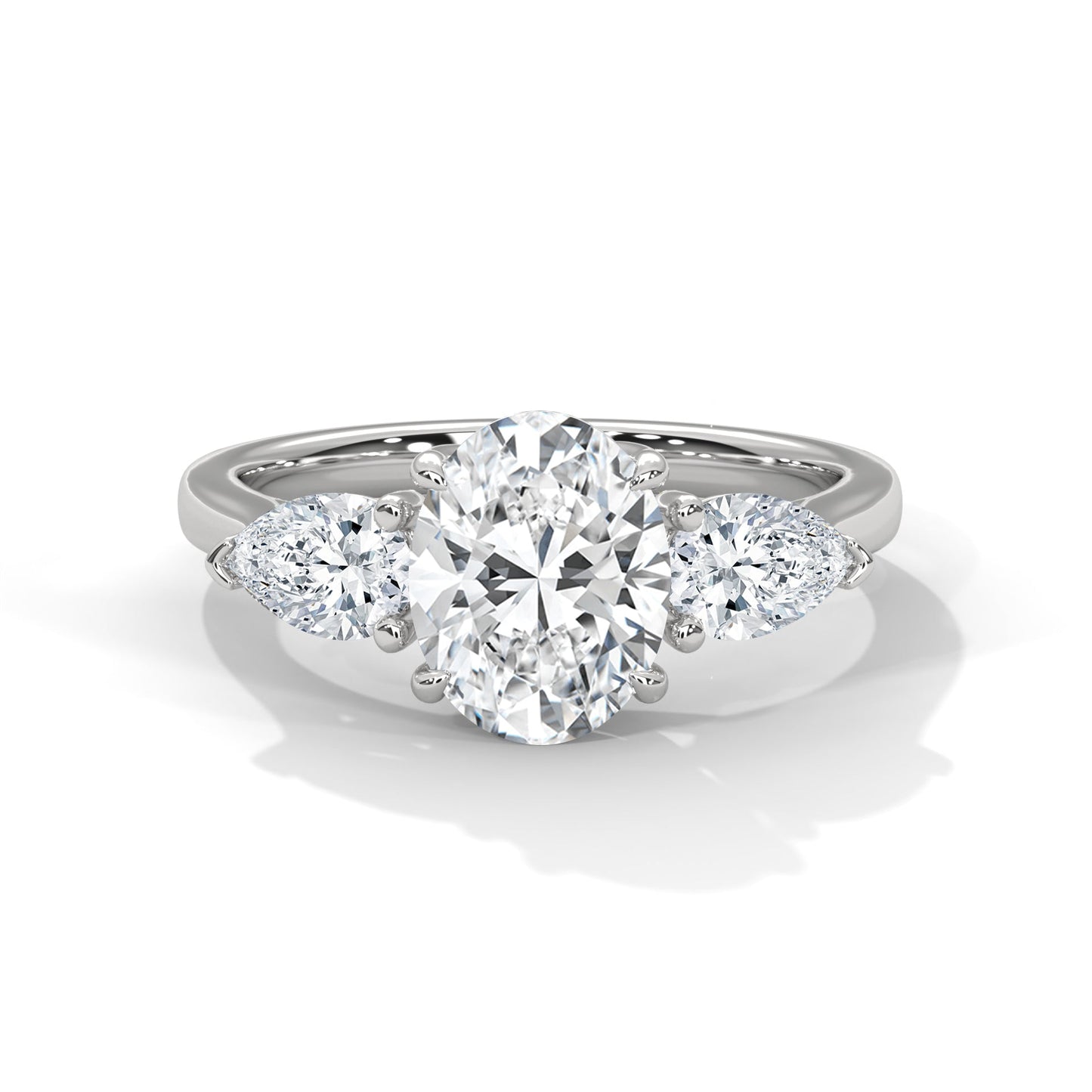 Diamond ring with a heart-shaped center stone on a white background
