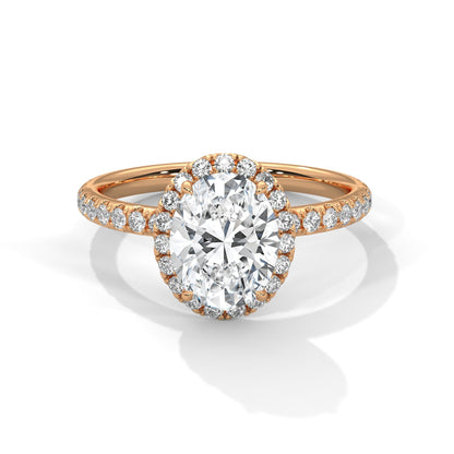 Rose gold ring with a large diamond and smaller diamonds on the band against a white background