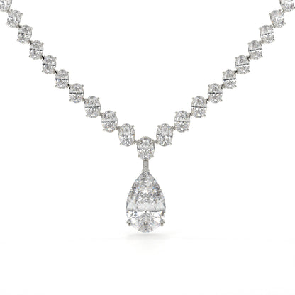 Diamond necklace with a teardrop pendant on a white background