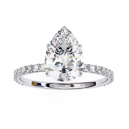 Diamond ring with a pear-shaped center stone on a white background