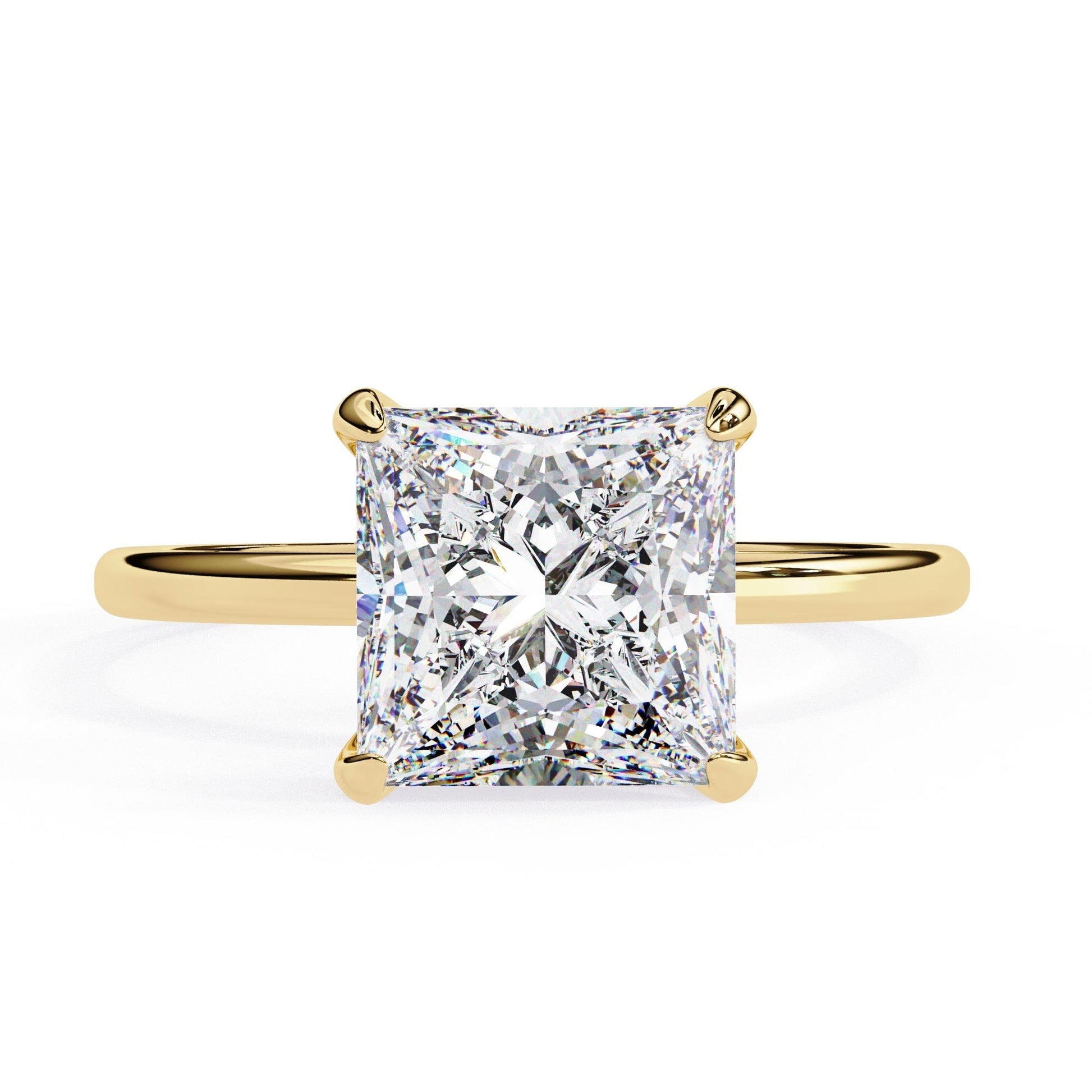 Gold ring with a large diamond on a white background