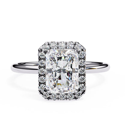 Diamond ring with a rectangular cut gemstone on a white background