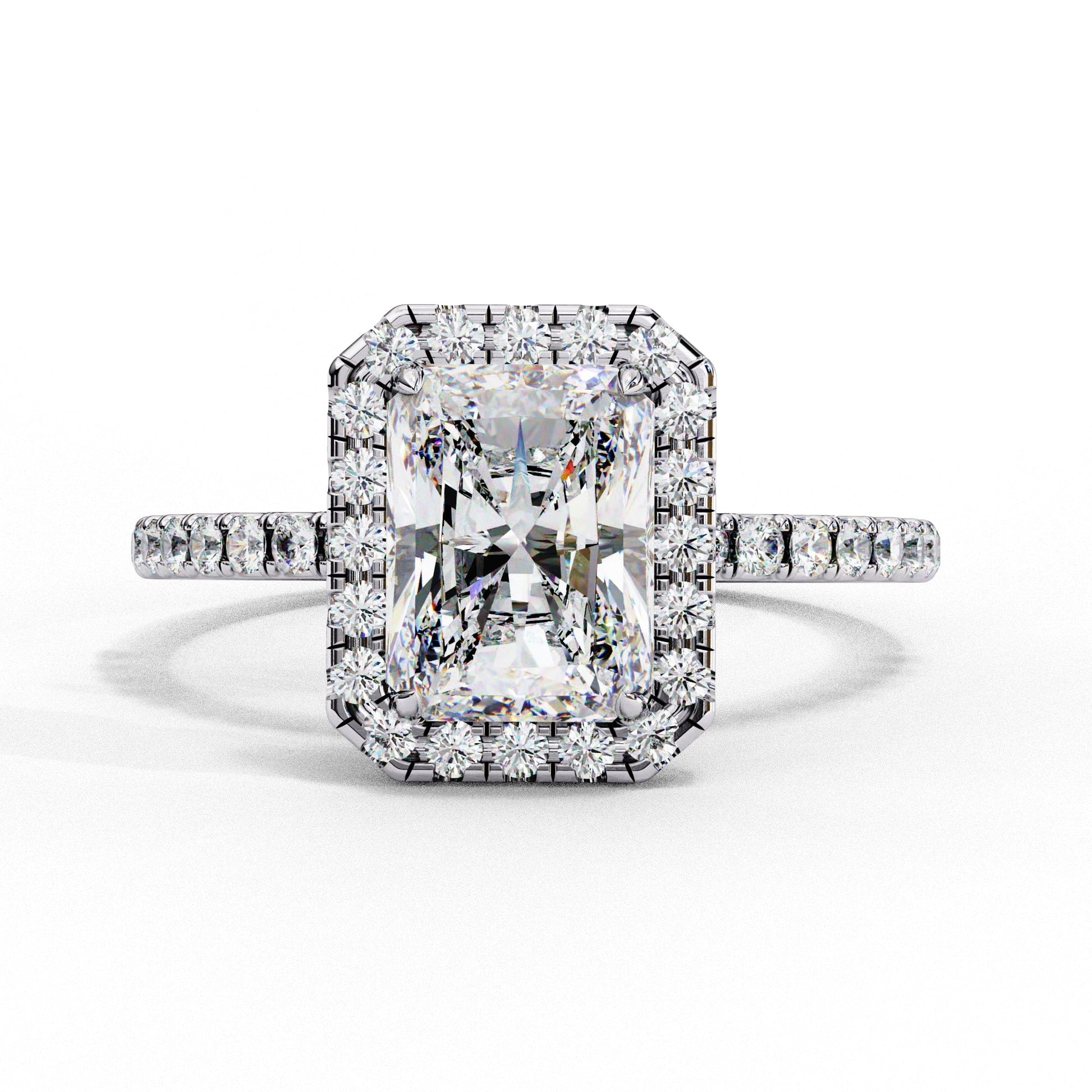Diamond ring with a large central gemstone and smaller stones on a white background