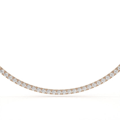 Rose gold necklace with diamonds on a white background