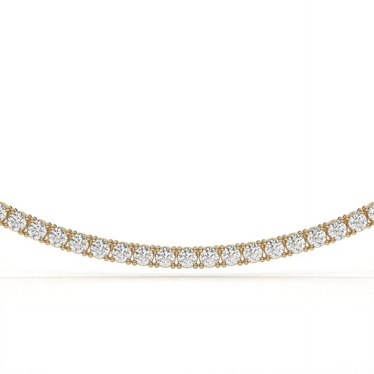 Gold necklace with clear gemstones on a white background
