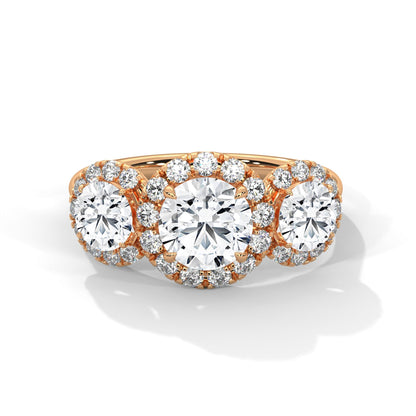 Diamond ring with rose gold band on a white background