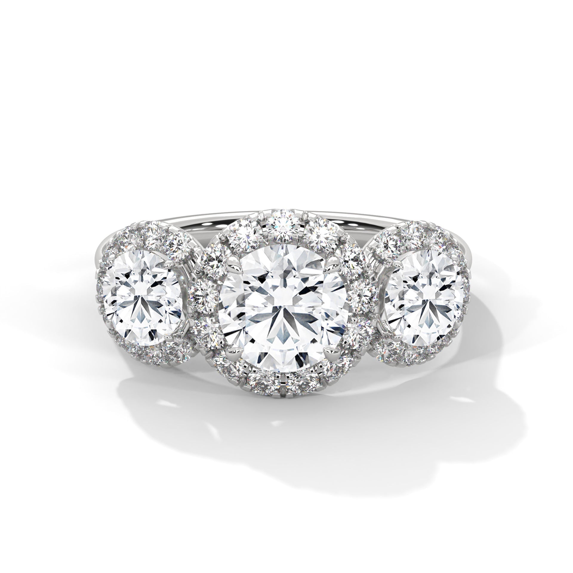 Diamond ring with three circular diamonds on a white background