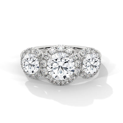 Diamond ring with three circular diamonds on a white background