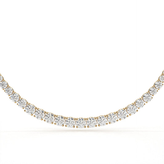 Gold necklace with clear gemstones on a white background