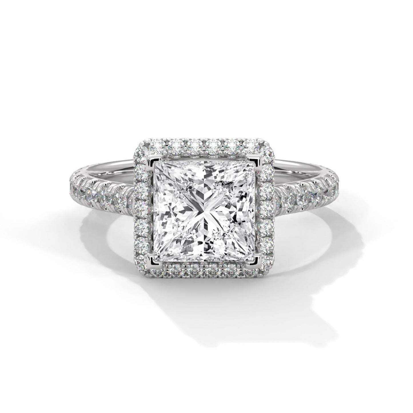 Diamond ring with a square-cut center stone on a white background