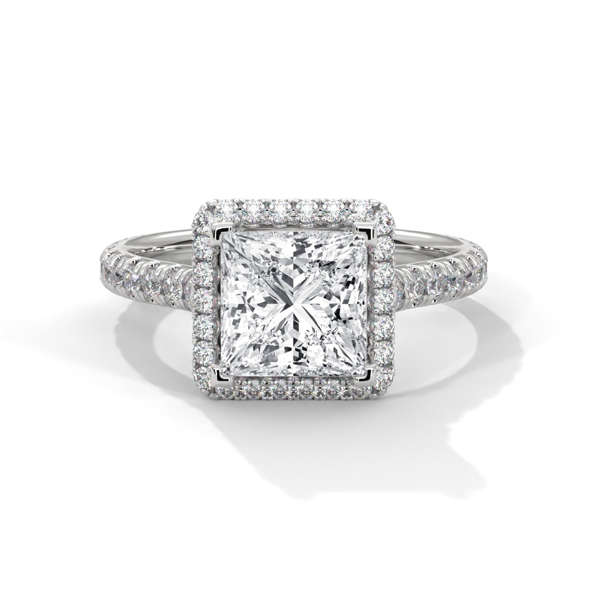 Diamond ring with a square-cut center stone on a white background