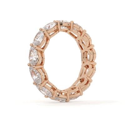 Rose gold ring with diamond accents on a white background
