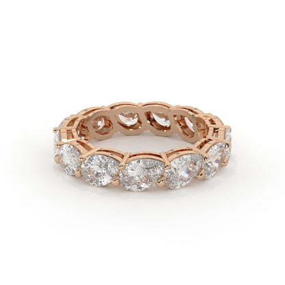 Rose gold ring with diamonds on a white background