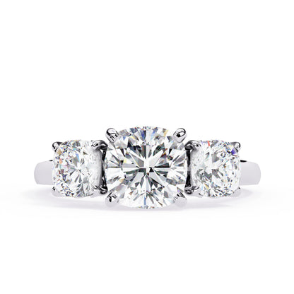 Diamond ring with three round-cut diamonds on a white background