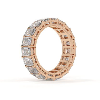 Rose gold ring with diamond accents on a white background