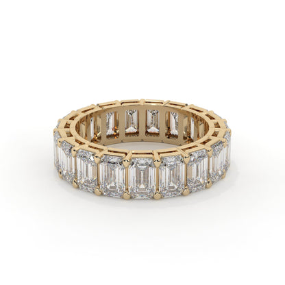 Emerald cut diamond eternity ring featuring a prong setting on a plain background.