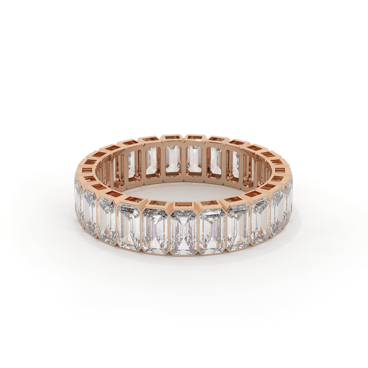 Rose gold ring with emerald-cut diamonds on a white background