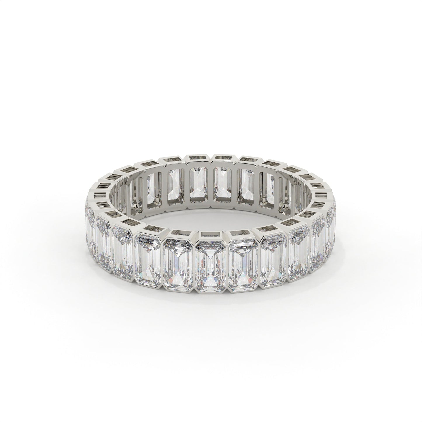 Diamond ring with emerald-cut stones on a white background