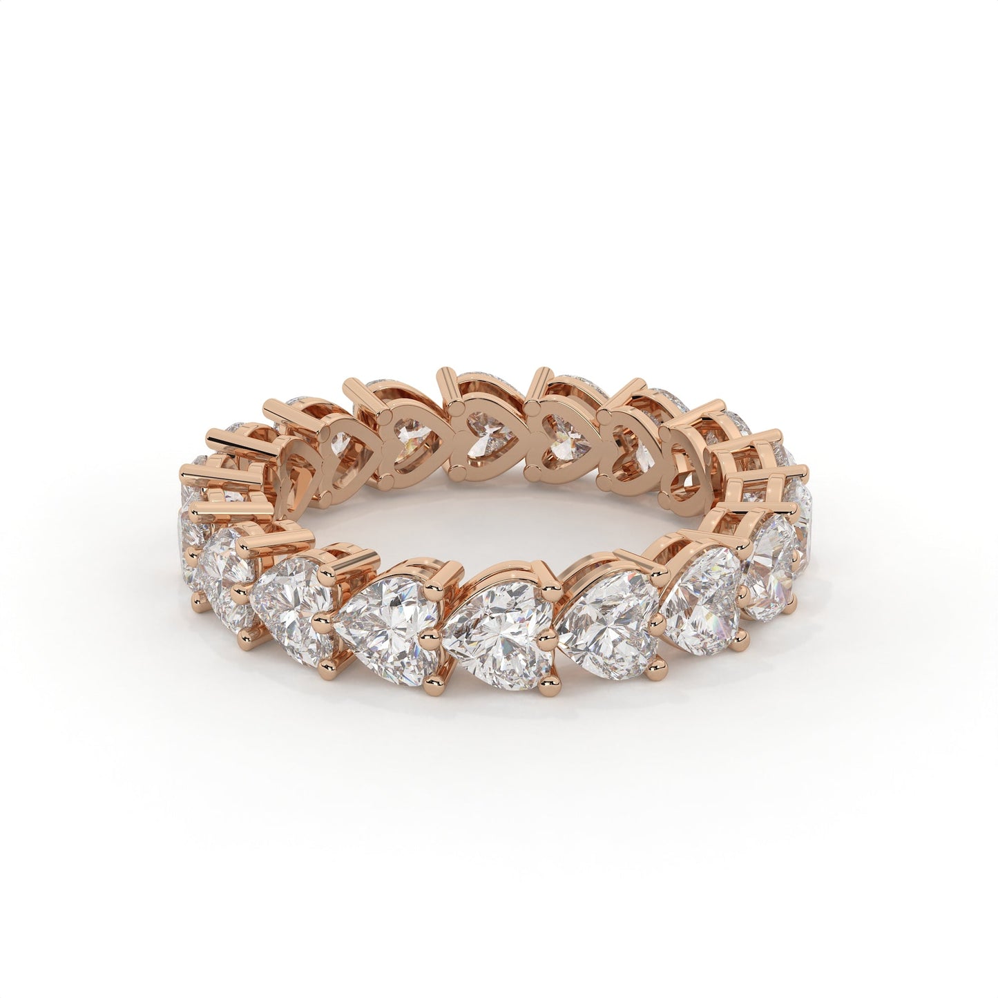 Rose gold ring with heart-shaped diamonds on a white background