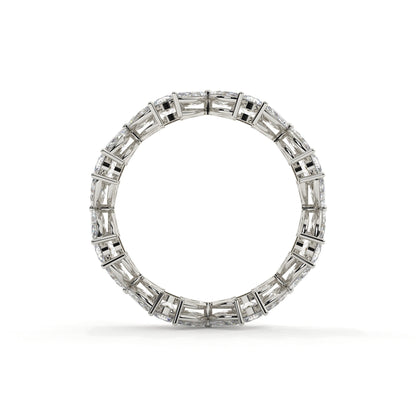 Diamond ring with baguette and round cut stones on a white background