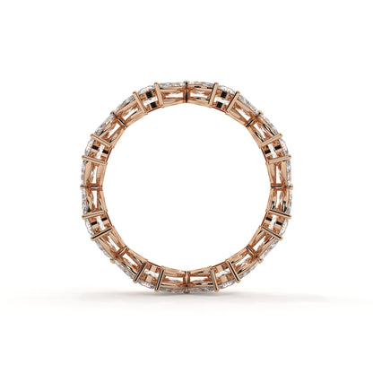 Rose gold ring with diamond accents on a white background