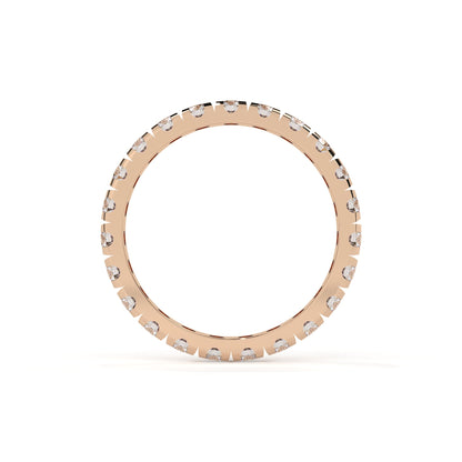 Rose gold ring with small diamonds on a white background